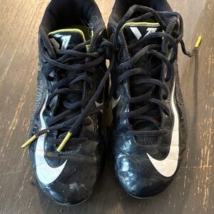 Nike Kids Black and White cleats with Yellow Accents